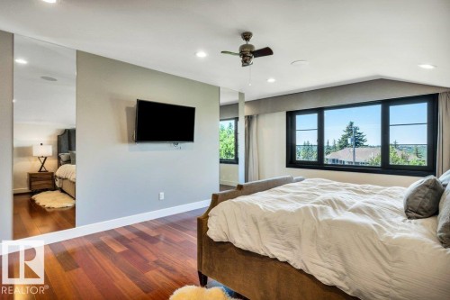 Bedroom featuring wood-finish flooring, recessed lighting, and a ceiling fan - 8914 120 Street, Edmonton, AB 