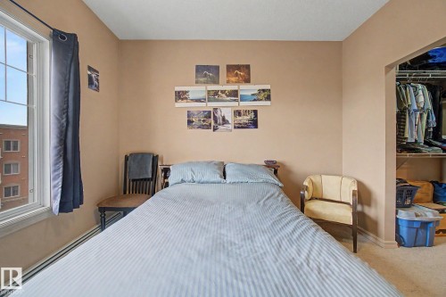 Bedroom featuring neutral-toned walls and carpeted flooring - 415 263 Macewan Road, Edmonton, AB 