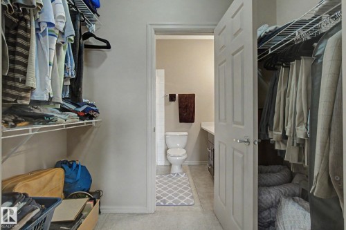 Walk-in closet featuring wire shelving and hanging rods - 415 263 Macewan Road, Edmonton, AB 