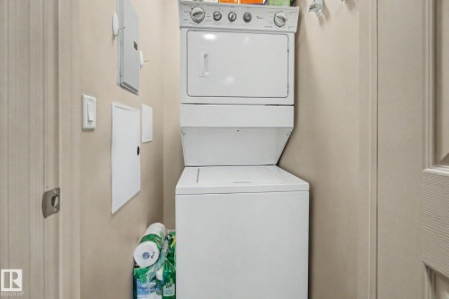 Dedicated laundry area featuring a stacked washer and dryer unit - 415 263 Macewan Road, Edmonton, AB 