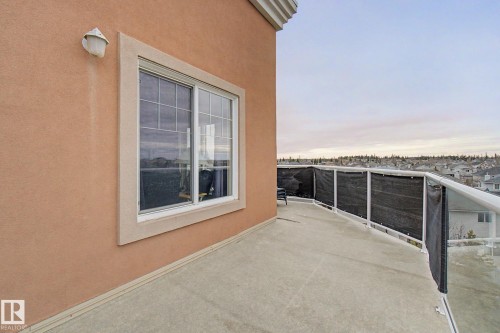 Outdoor balcony featuring a concrete surface and glass railing - 415 263 Macewan Road, Edmonton, AB 