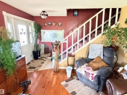 Hardwood-finish flooring extending from the entryway into the living area - 