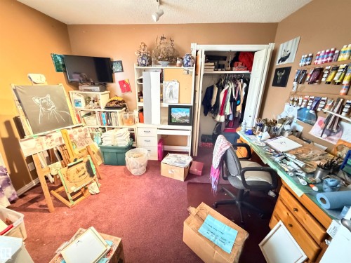 Recessed lighting illuminates a space featuring a built-in closet with an open door - 26418 Twp Rd 633, Rural Westlock County, AB 