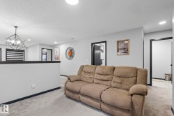 Open concept area with light gray walls and contrasting dark trim - 