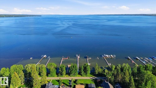 Expansive waterfront featuring multiple private docks and direct lake access - 1410 47436 Range Rd. 15, Rural Leduc County, AB 