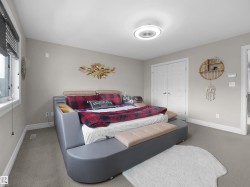 Neutral gray wall paint and light gray carpet flooring define this space - 
