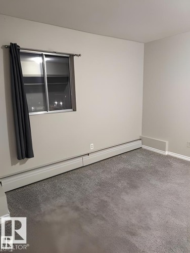Room featuring light gray carpet flooring and neutral wall tones - 611 12831 66 Street, Edmonton, AB 