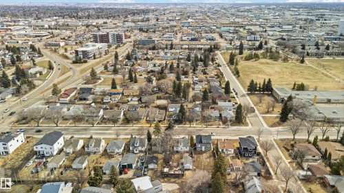 Aerial perspective of an established residential area featuring mature trees and a mix of single-family homes - 6036 106 Street, Edmonton, AB 