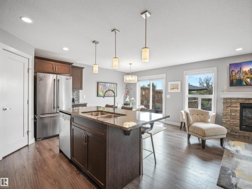 1277 Starling Drive, Edmonton, AB - Indoor Photo Showing Kitchen With Fireplace With Double Sink With Upgraded Kitchen