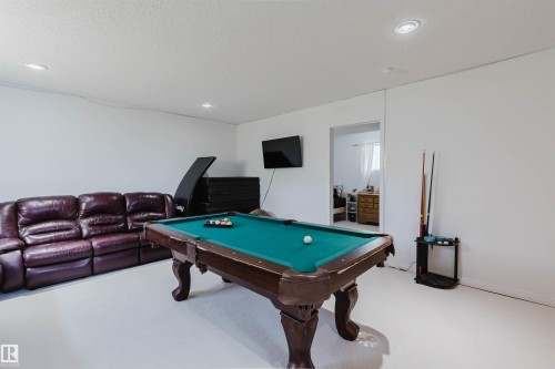 Recreation room featuring white walls, light-colored flooring, and recessed ceiling lighting - 1743 Melrose Crescent Sw, Edmonton, AB 