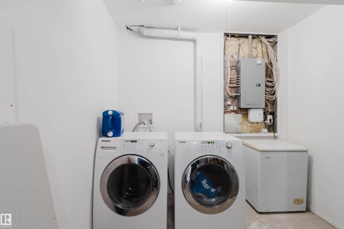 Utility space featuring white painted walls and concrete flooring - 1743 Melrose Crescent Sw, Edmonton, AB 