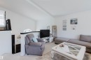 Vaulted ceilings enhance this living area with white walls and light-toned carpet - 1743 Melrose Crescent Sw, Edmonton, AB 