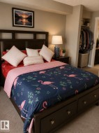 Dark wood-finish bed frame featuring under-bed storage drawers and a slatted headboard - 