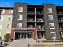 Multi-story building facade featuring stone veneer accents - 128 1510 Watt Drive Sw, Edmonton, AB 