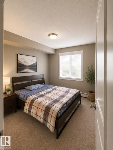 Neutral wall paint, light-colored carpeting, and a window with blinds - 128 1510 Watt Drive Sw, Edmonton, AB 