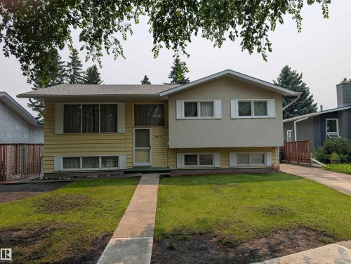Split-level residence featuring a partial stucco and horizontal siding facade - 6415 147 Avenue, Edmonton, AB 