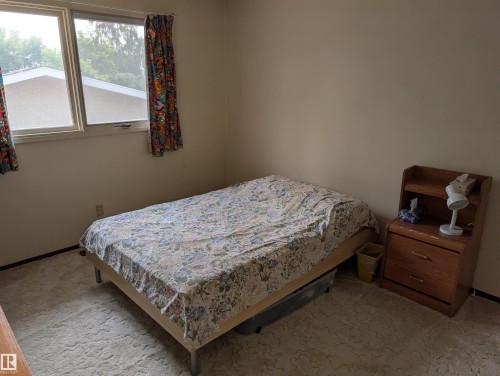 Wall-to-wall carpeting in a neutral tone, complemented by a muted wall color - 6415 147 Avenue, Edmonton, AB 