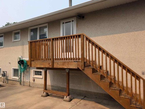 Exterior wood-finish deck with full balustrade and staircase - 6415 147 Avenue, Edmonton, AB 