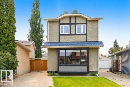 Two-story stucco exterior with decorative timber accents - 18609 54 Avenue, Edmonton, AB 
