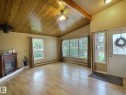 Vaulted wood-plank ceiling featuring an exposed beam and ceiling fan - 79 Grosvenor Boulevard, St. Albert, AB 