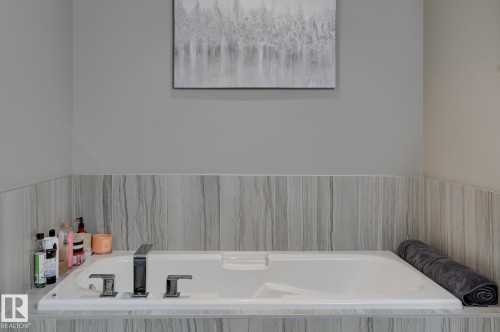 Built-in soaking tub featuring polished chrome fixtures - 101 Hilldowns Drive, Spruce Grove, AB 