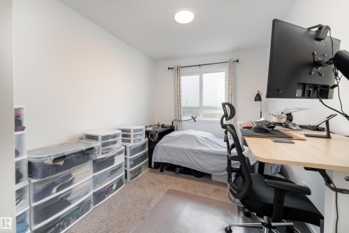 Neutral-toned wall paint throughout - 2522 152 Avenue Nw, Edmonton, AB - Indoor Photo Showing Bedroom
