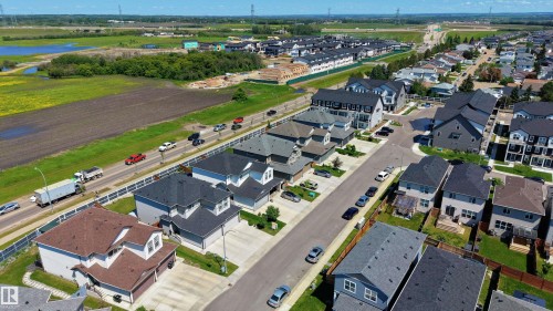 Aerial perspective showcasing a residential community with varied architectural styles - 2522 152 Avenue Nw, Edmonton, AB - Outdoor With View