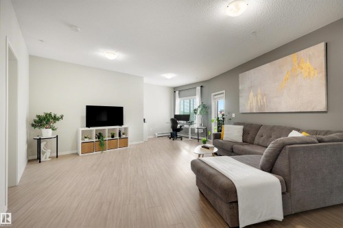 437 1818 Rutherford Road, Edmonton, AB - Indoor Photo Showing Living Room