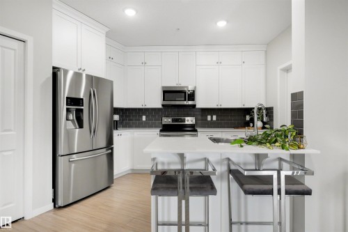 437 1818 Rutherford Road, Edmonton, AB - Indoor Photo Showing Kitchen With Stainless Steel Kitchen With Upgraded Kitchen