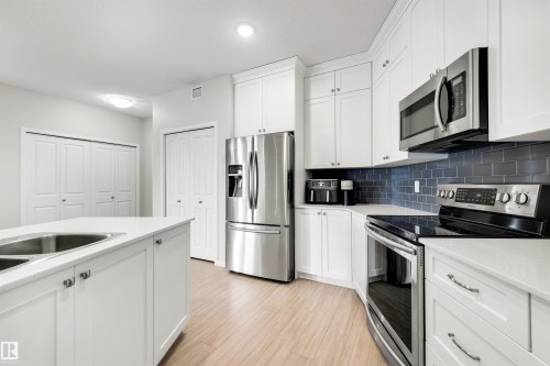 437 1818 Rutherford Road, Edmonton, AB - Indoor Photo Showing Kitchen With Stainless Steel Kitchen