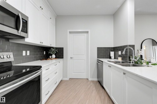 437 1818 Rutherford Road, Edmonton, AB - Indoor Photo Showing Kitchen With Double Sink With Upgraded Kitchen