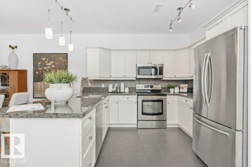 #302 160 Magrath Rd Nw, Edmonton, AB - Indoor Photo Showing Kitchen With Upgraded Kitchen