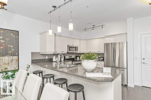 #302 160 Magrath Rd Nw, Edmonton, AB - Indoor Photo Showing Kitchen With Double Sink With Upgraded Kitchen