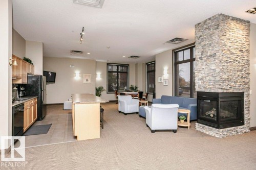 #302 160 Magrath Rd Nw, Edmonton, AB - Indoor With Fireplace