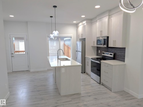 9455 Colak Lane Sw, Edmonton, AB - Indoor Photo Showing Kitchen With Double Sink