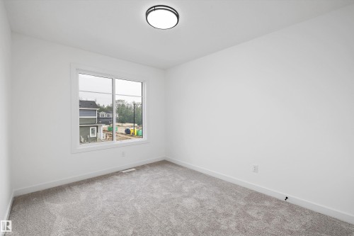 Empty room - 915 Elderberry Landing Nw, Edmonton, AB - Indoor Photo Showing Other Room