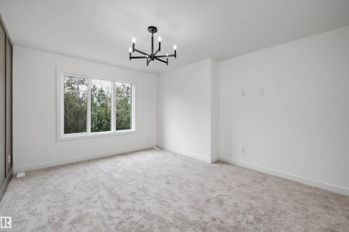 Empty room - 915 Elderberry Landing Nw, Edmonton, AB - Indoor Photo Showing Other Room