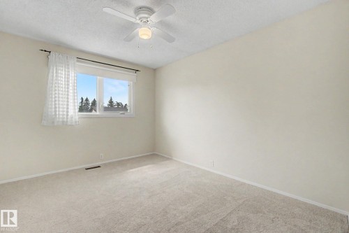 Room featuring neutral carpeting, light-toned walls, and a multi-pane window - 170 Westridge Rd, Edmonton, AB - Indoor Photo Showing Other Room