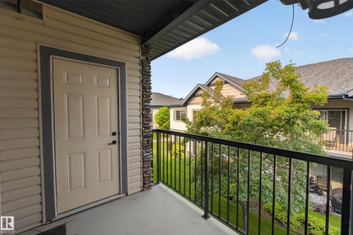 Private balcony featuring a black metal railing and concrete flooring - 18 2565 Hanna Crescent, Edmonton, AB 