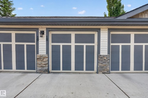 Three garage doors featuring panel detailing - 18 2565 Hanna Crescent, Edmonton, AB 