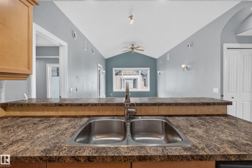 Kitchen countertop with integrated double stainless steel sink - 18 2565 Hanna Crescent, Edmonton, AB 