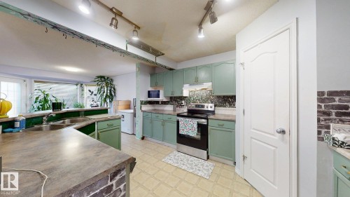 1808 36 Avenue Nw, Edmonton, AB - Indoor Photo Showing Kitchen With Double Sink