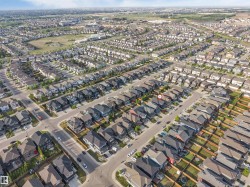 Aerial perspective of a developed residential area featuring a distinct street layout - 