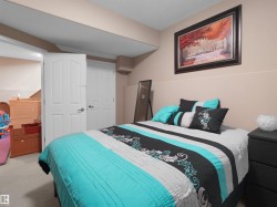 Neutral-toned walls complement the light-colored carpet flooring - 