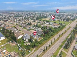 Aerial perspective showcasing a residential neighborhood with established homes and mature landscaping - 
