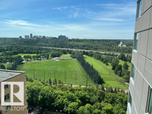 Expansive green space featuring a golf course, driving range, and distant city skyline - 1101 10011 123 Street, Edmonton, AB 