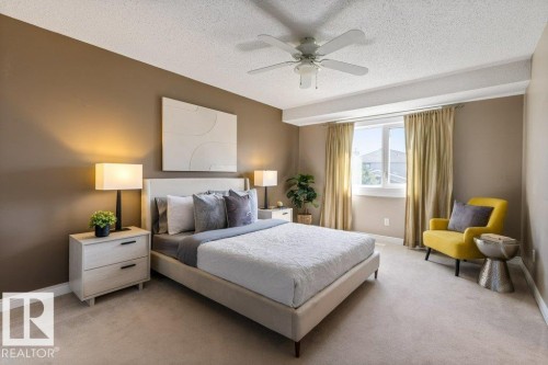 Bedroom featuring a ceiling fan, recessed window, and light-colored carpeting - 1119 Potter Greens, Edmonton, AB - Indoor Photo Showing Bedroom
