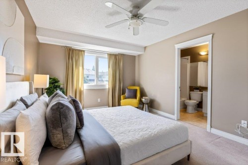 Carpeted sleeping area with neutral wall tones and a ceiling fan - 1119 Potter Greens, Edmonton, AB - Indoor Photo Showing Bedroom