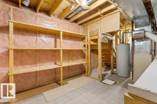 Basement space featuring exposed wood framing, insulation, and utility access - 1119 Potter Greens, Edmonton, AB - Indoor Photo Showing Basement
