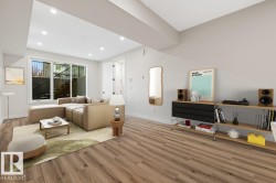 Open-concept living space with wood-finish flooring - 